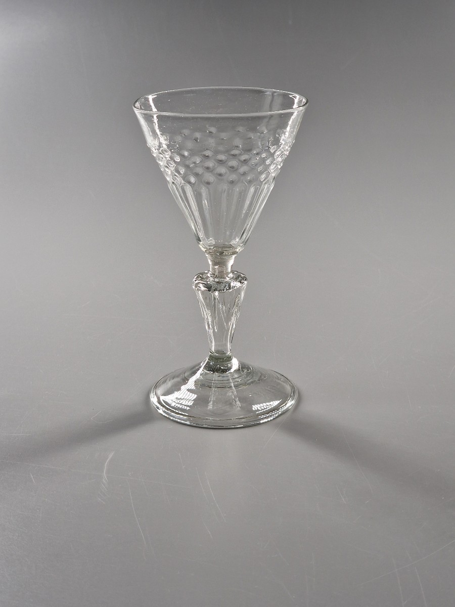 Molded Cup Glass With Rice Grain And Tab Shapes On A Grooved Hollow Stem. 18th Century