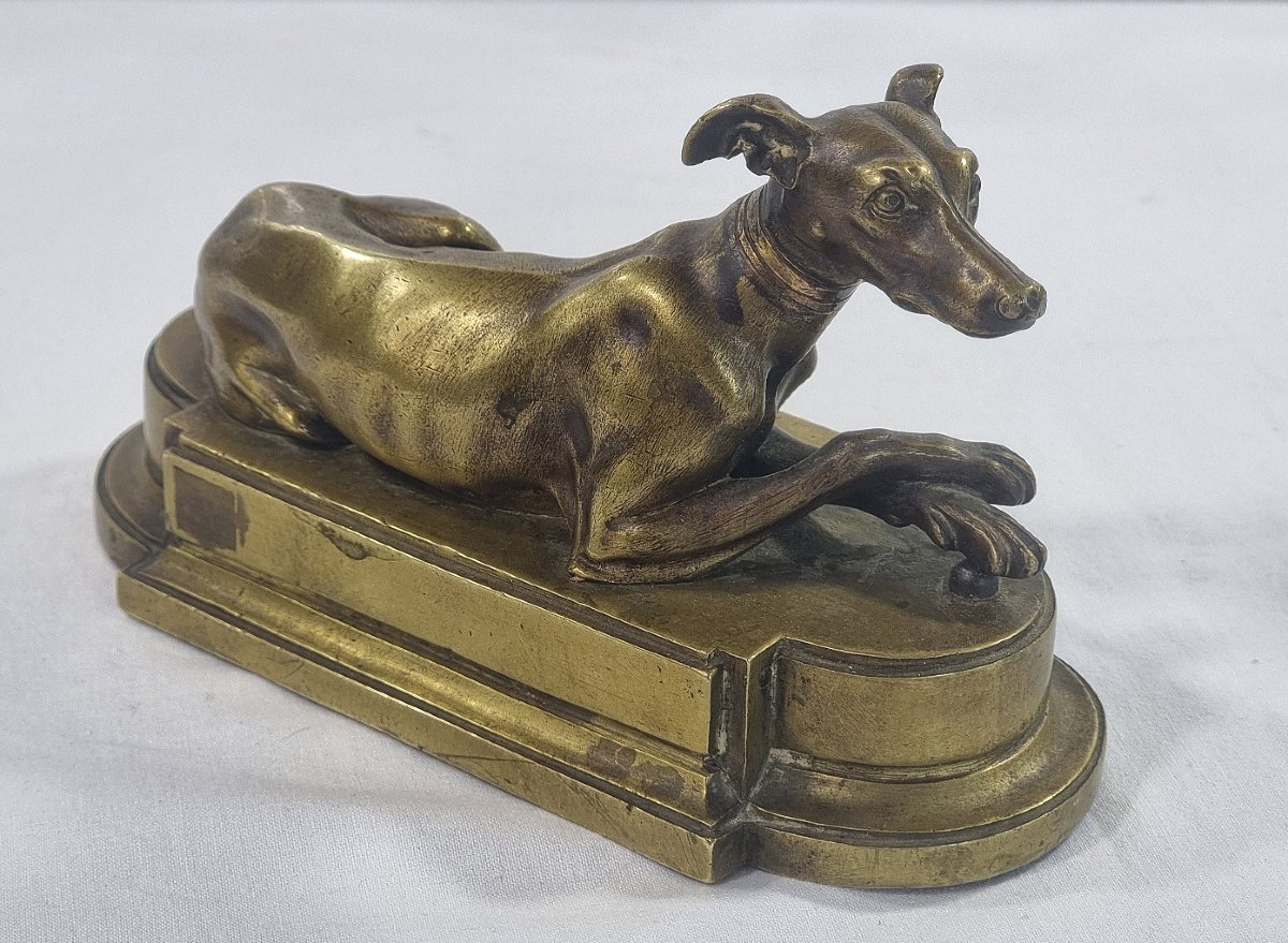 Antique French Sculpture In Solid Brass Depicting A Reclining Greyhound On A Classic Base