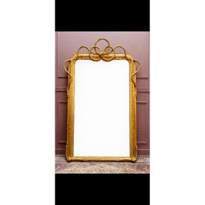 Miroir doré de style Louis XVI 