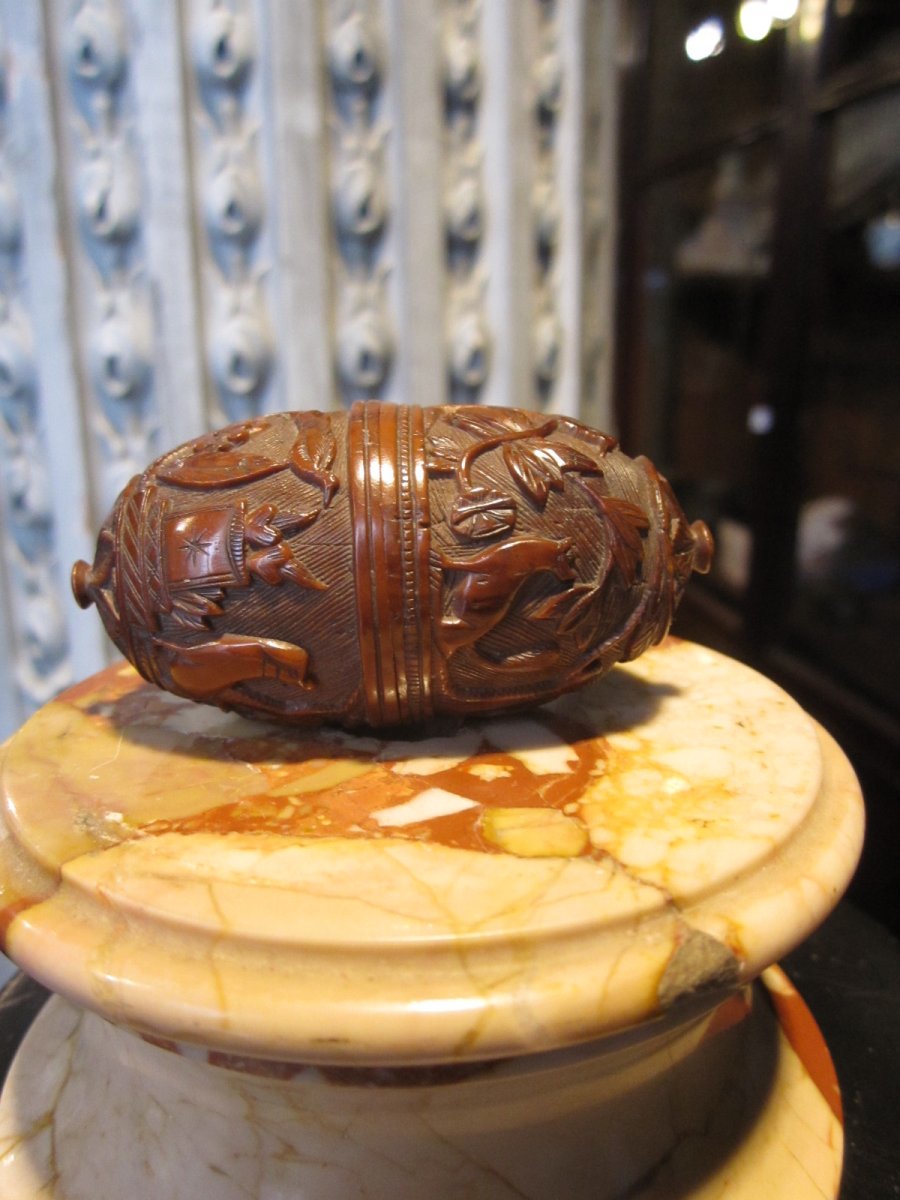 Coroso Egg Finely Carved And Animated A Scene With Animals.