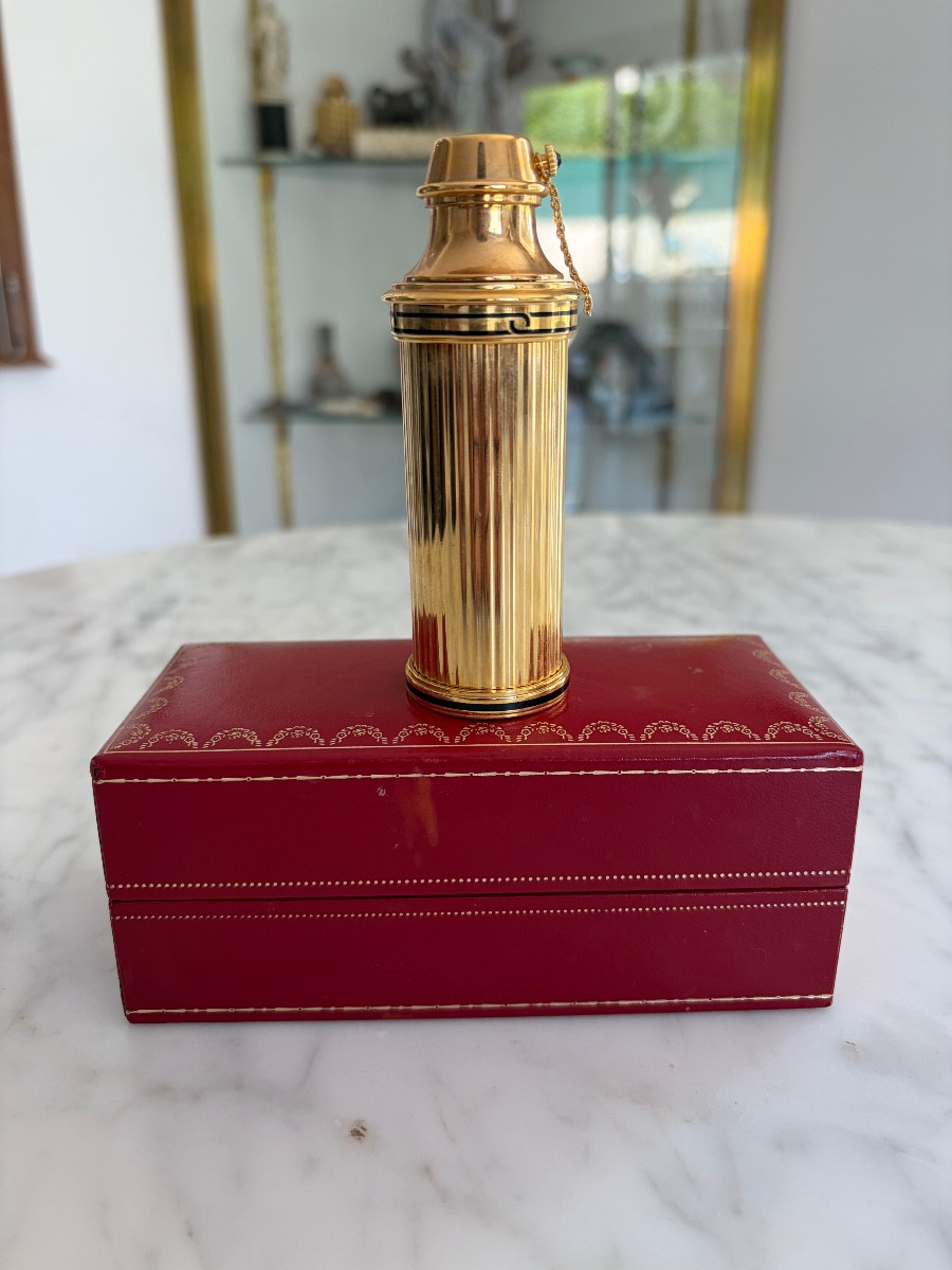 CARTIER vaporisateur de sac en métal doré dans son coffret