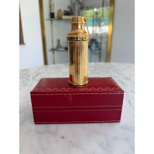 CARTIER vaporisateur de sac en métal doré dans son coffret