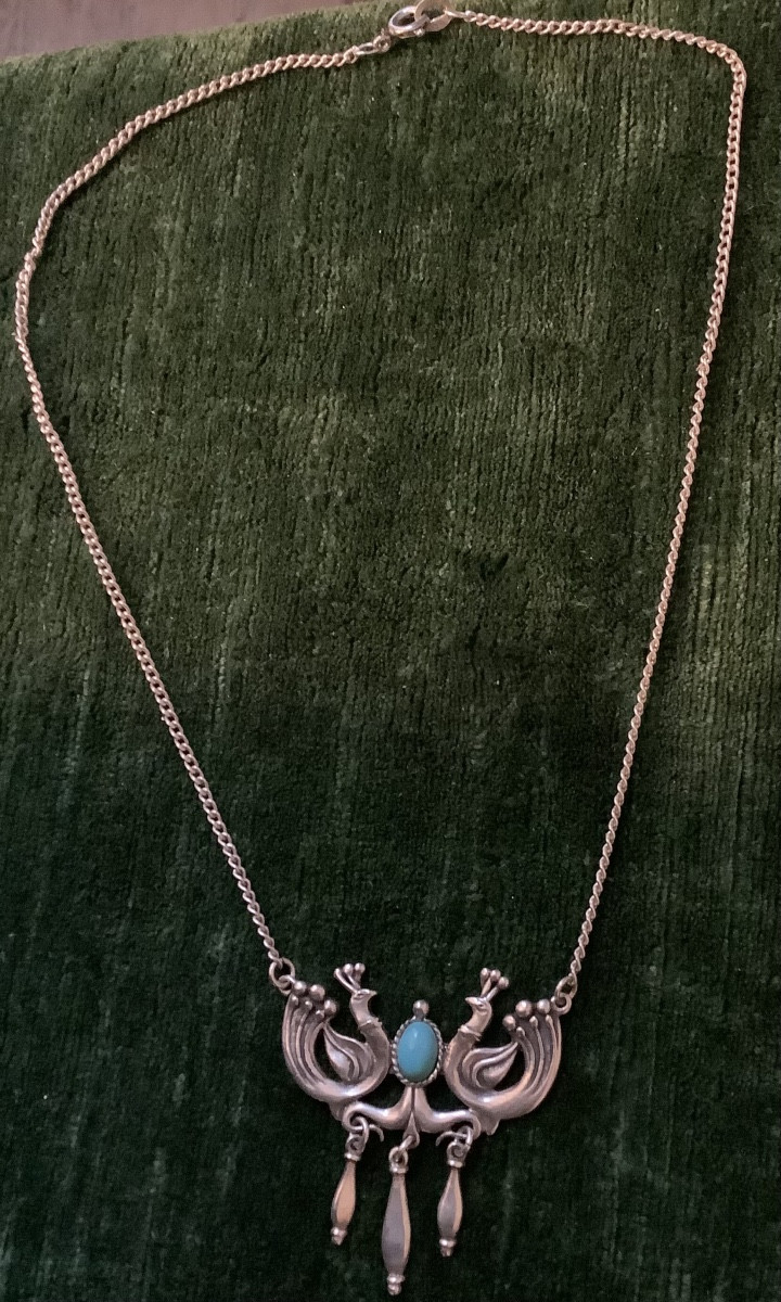 Collier en l’oiseaux fantastique au centre turquoise en argent