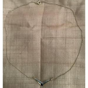 Articulated Necklace In 750-millimeter Gold With A Pear-shaped Sapphire In The Center.