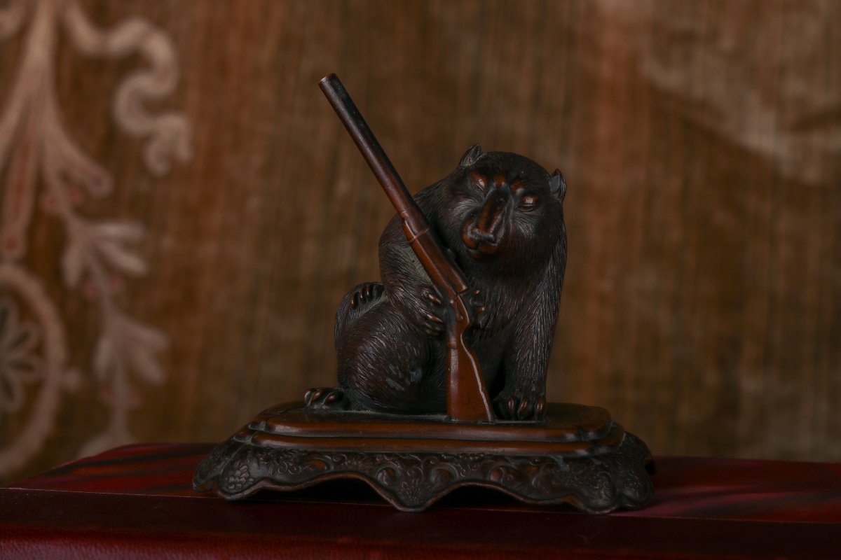 Small Animal Holding A Gun