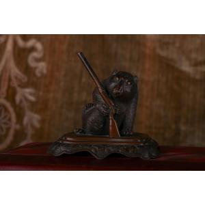 Small Animal Holding A Gun