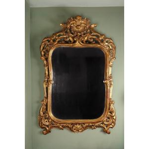 Grand miroir en bois doré d'époque XVIIIem