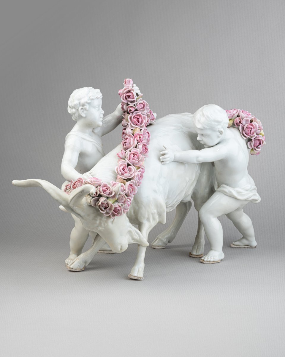 Porcelain Group: Putti Adorning A Goat With Flowers, 19th Century