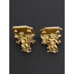 Paire de consoles d’appliques aux putti musiciens - bois doré - fin XIXè siècle