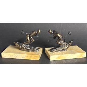 Paire de serres livres Skieurs Art Deco en très bon état ski montagne Alpes