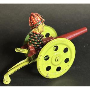 Ancien jouet mécanique 1930 en tôle lithographiée à ressort manuel en très bon état collection 