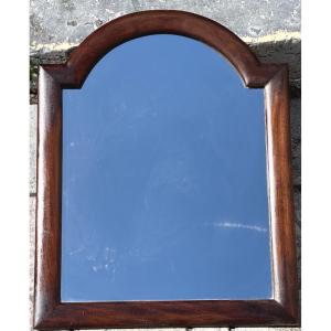 Miroir XIXe en acajou à fronton galbé 58x45,5cm