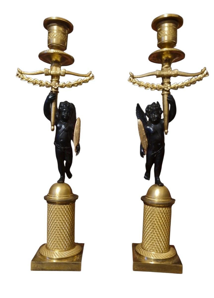 Pair Of Bronze Candlesticks Decorated With Cherubs