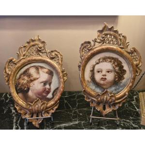 Pair Of Cherub Head Paintings, Gilded Frame