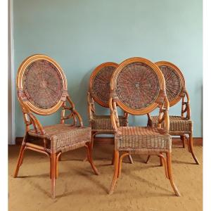 Suite de quatre chaises en rotin et bambou polychrome. (H 112 cm)