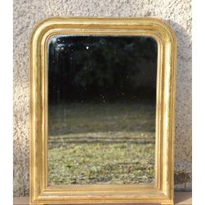 Petit miroir  Louis Philippe en bois et stuc doré à la feuille 
