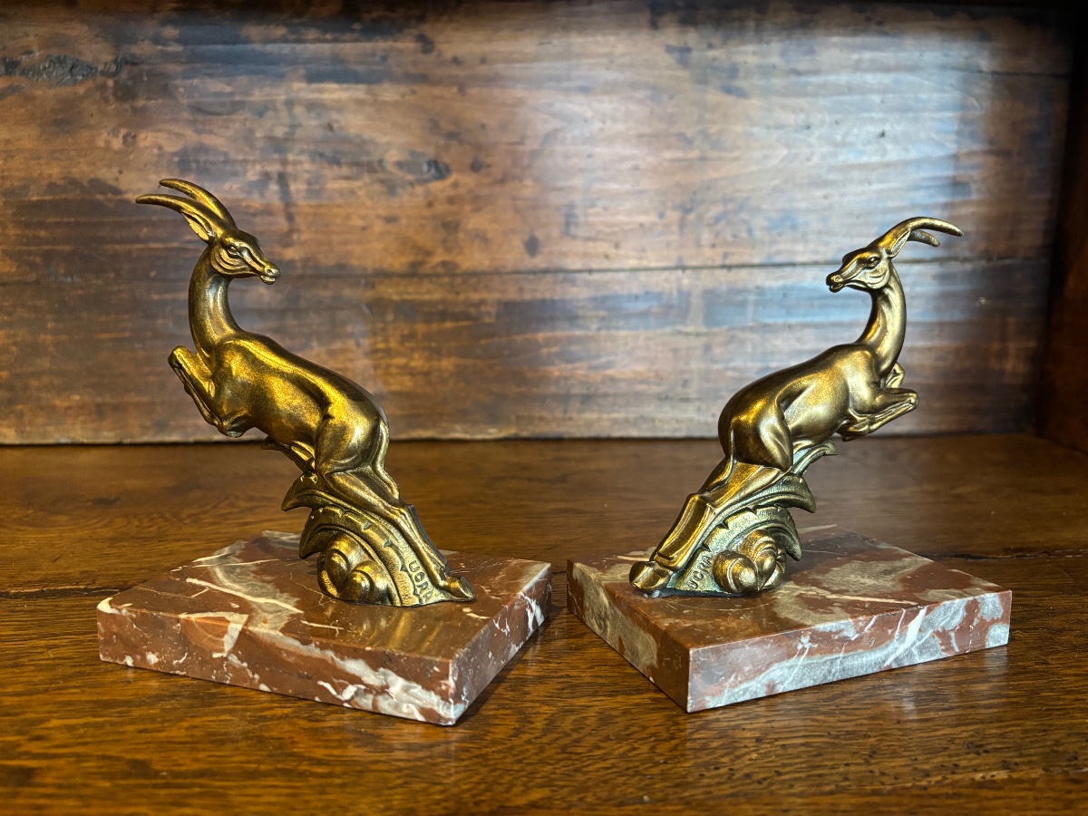 Paire de serre-livres Art Déco signés UCRA – Gazelles en régule et marbre-photo-1