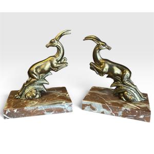 Paire de serre-livres Art Déco signés UCRA – Gazelles en régule et marbre