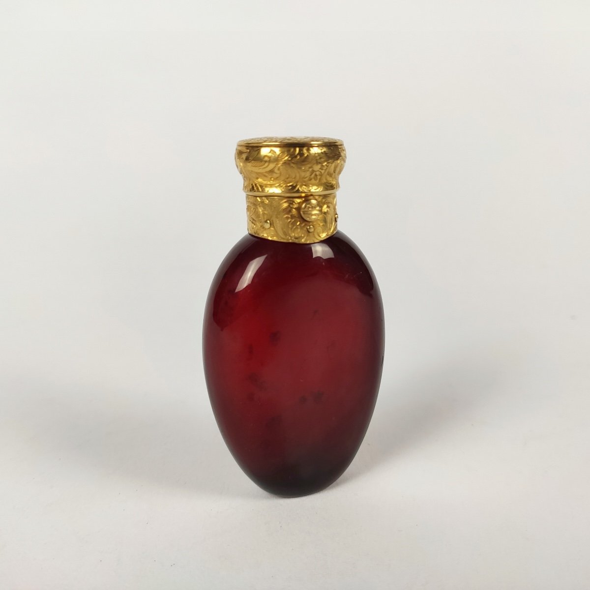 Magnificent Salt / Perfume Bottle In Red Glass And Large Gold Frame Engraved With Foliage. 