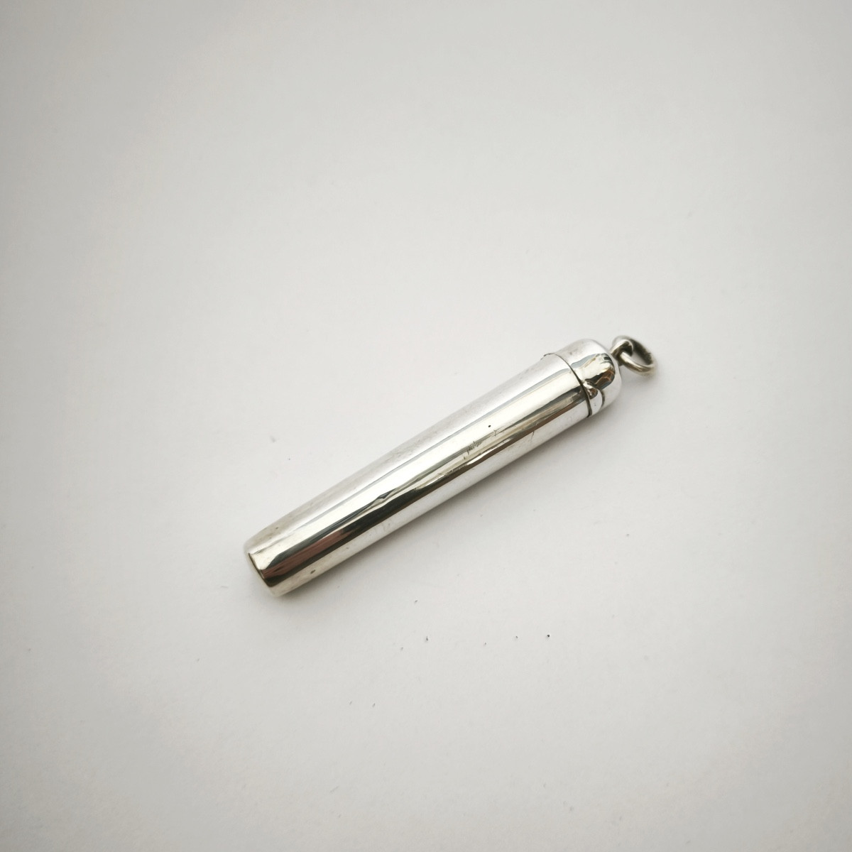 Silver Cigarette Holder; Fashionable Sautoir Pendant, Perfume Bottle. Late 19th Century