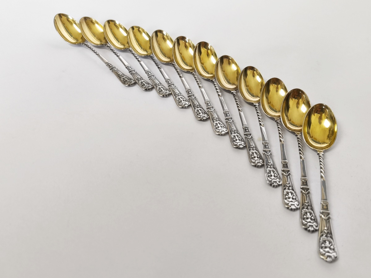 Christofle: Twelve Silver- And Gold-plated Spoons With A Mascaron Design. 