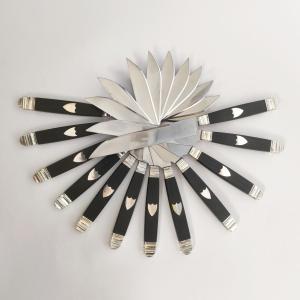 A Set Of Twelve Empire-style Table Knives Made Of Silver, Ebony, And Stainless Steel.