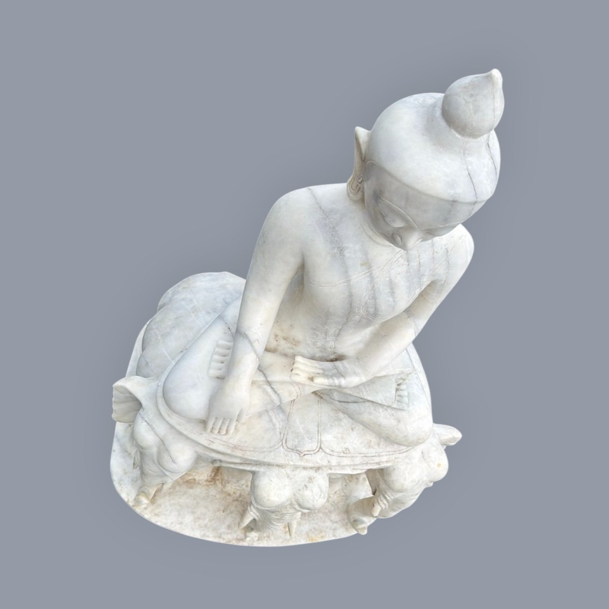 Marble Buddha Sculpture Seated On A Throne Of Elephants-photo-1