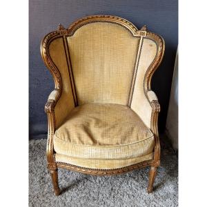 Fauteuil bergère en bois doré XIXe
