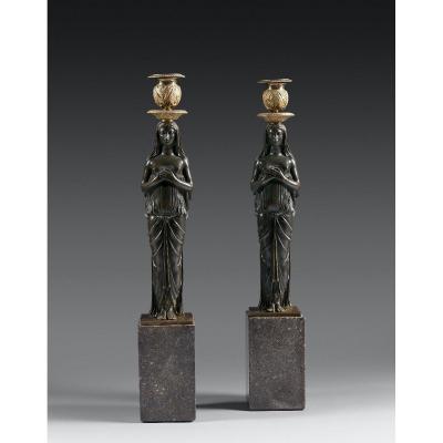 A Large Consulat Ormolu Candlesticks