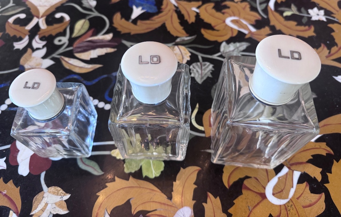 A Set Of Three Perfume Bottles In Crystal, Silver, And Ivory.-photo-4