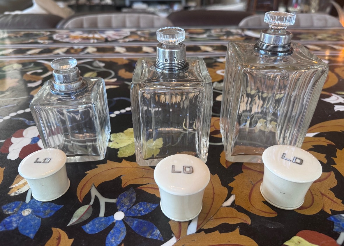 A Set Of Three Perfume Bottles In Crystal, Silver, And Ivory.-photo-1