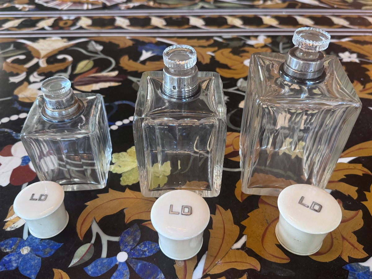 A Set Of Three Perfume Bottles In Crystal, Silver, And Ivory.-photo-3