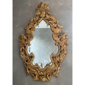 Large Italian Mirror In Carved Wood, Openwork And Gilded With Gold Leaf From The 18th Century