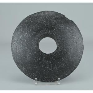 Stone Disc With A Central Hole—possibly A Clubhead From New Guinea