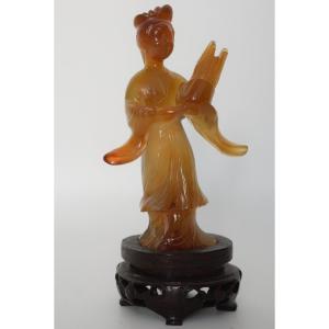 Carved Agate Statuette Of A Young Woman Holding A Traditional Sheng