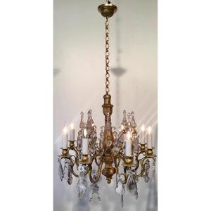 Chandelier In Bronze And Central Shaft In Golden Wood With 8 Arms Of Light And 8 Daggers