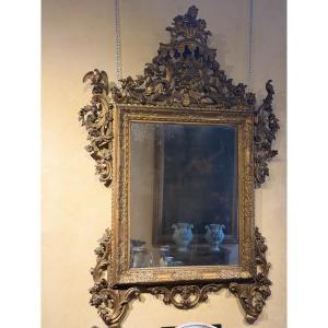 Important miroir Louis XIV en bois sculpté et doré, Venise, fin du XVIIe siècle
