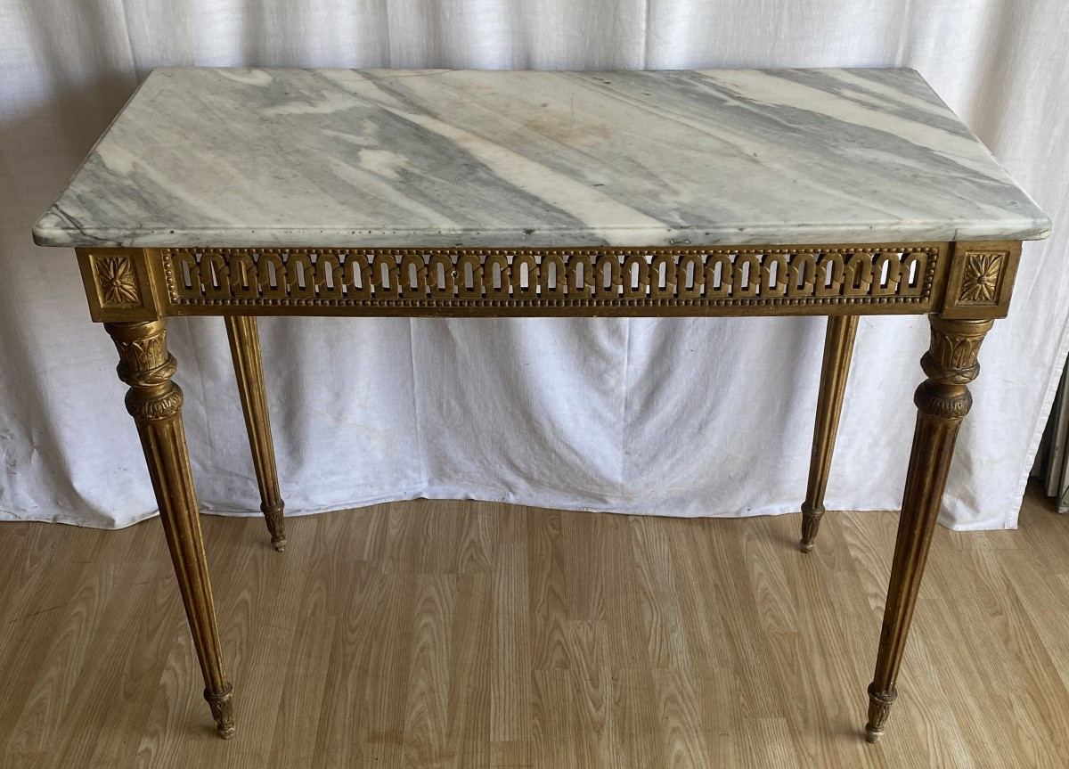 Grande console Louis XVI sculptée et dorée sur 4 pieds du XVIII ème
