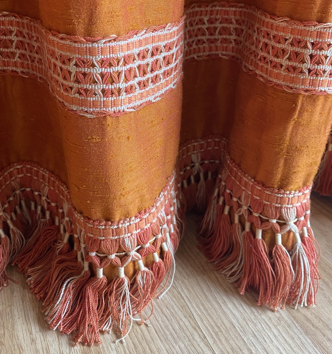 Pair Of Orange Curtains With Raspberry-colored Highlights -photo-4