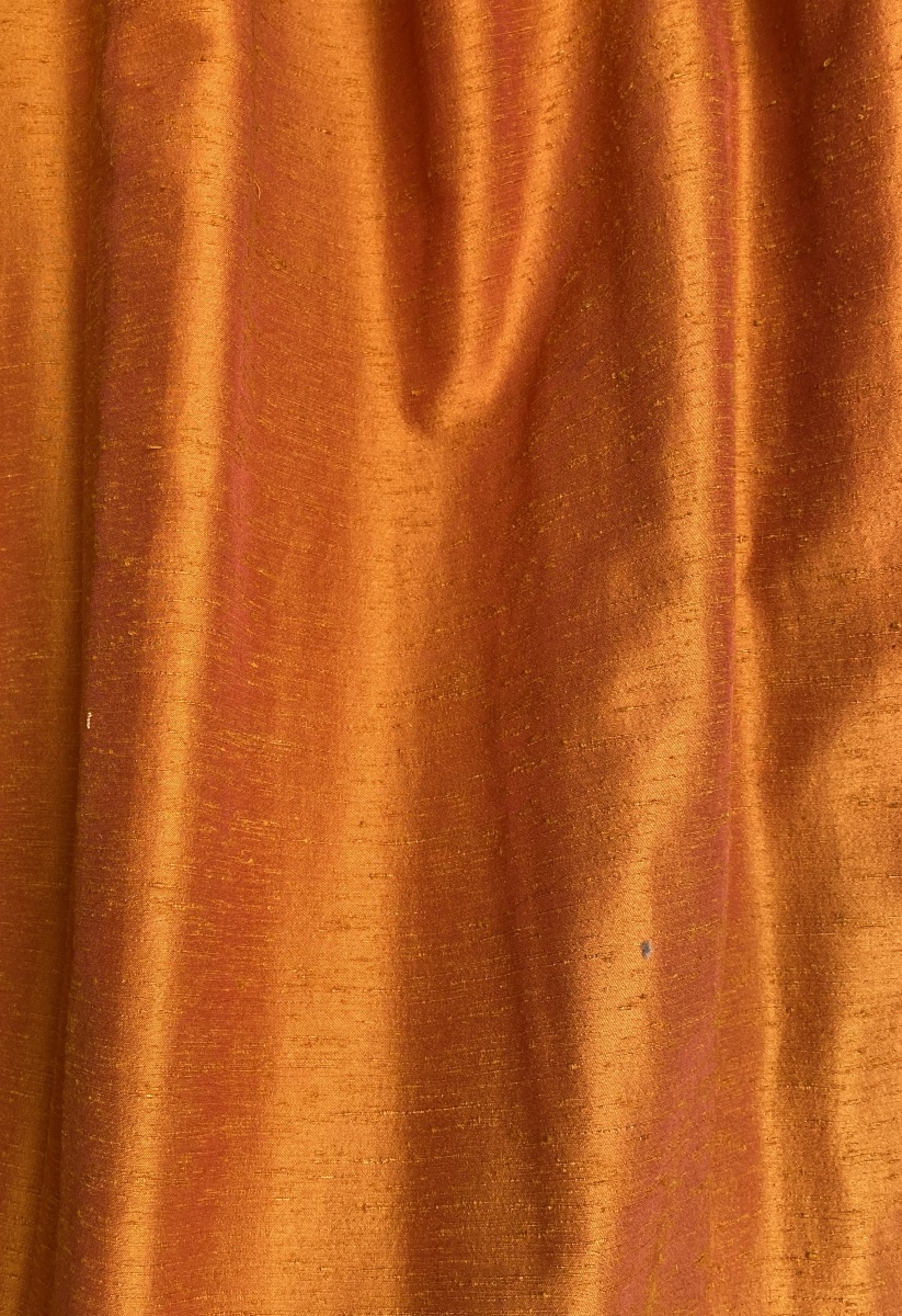 Pair Of Orange Curtains With Raspberry-colored Highlights -photo-2
