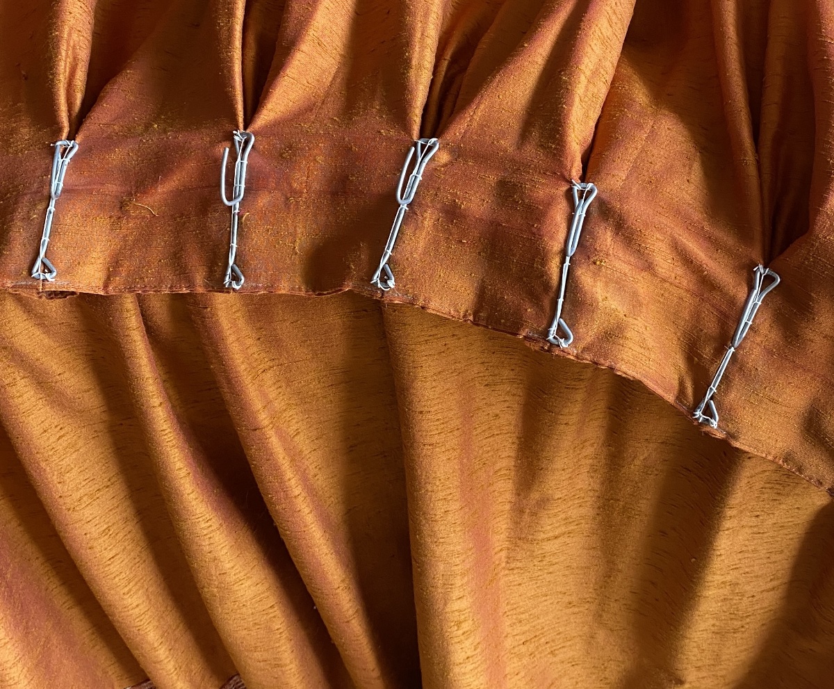 Pair Of Orange Curtains With Raspberry-colored Highlights -photo-4
