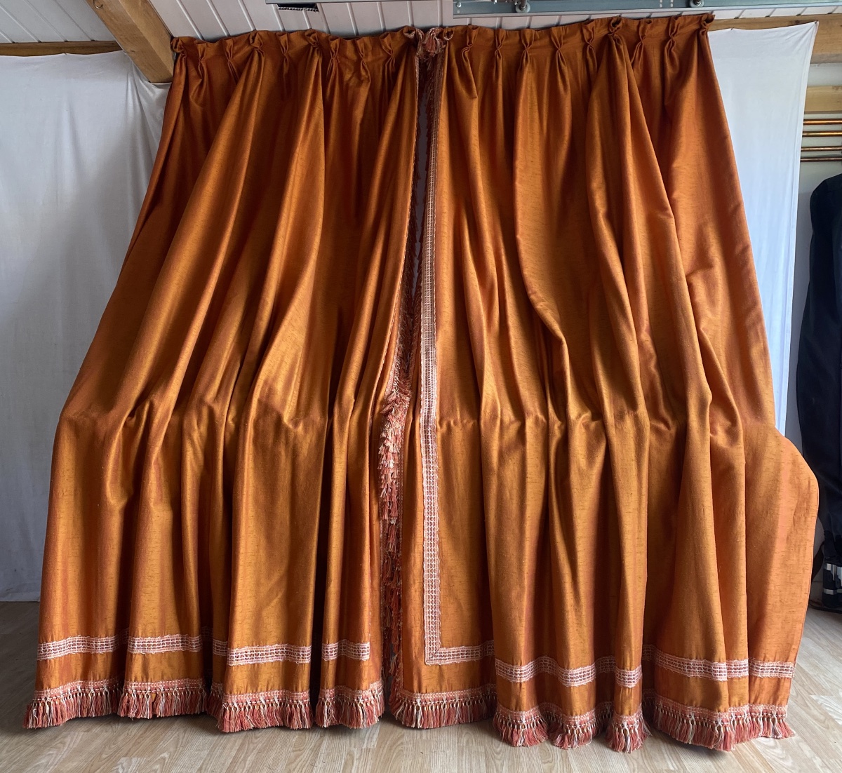 Pair Of Orange Curtains With Raspberry-colored Highlights 