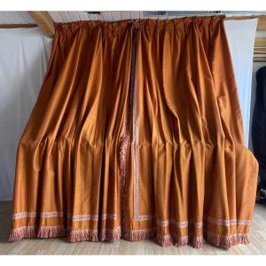 Pair Of Orange Curtains With Raspberry-colored Highlights 