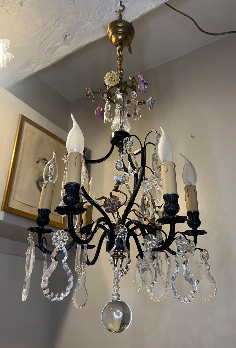 Old Chandelier Decorated With Flowers 