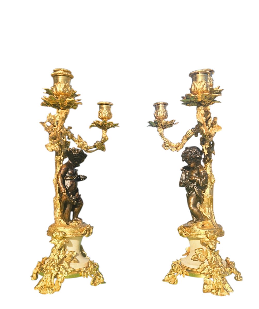 Paire de candélabres aux "putti"en bronze doré XIXème-photo-1