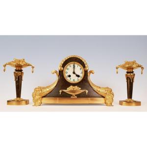 Art Deco Pendulum And Cassolettes In Gilt And Patinated Bronze