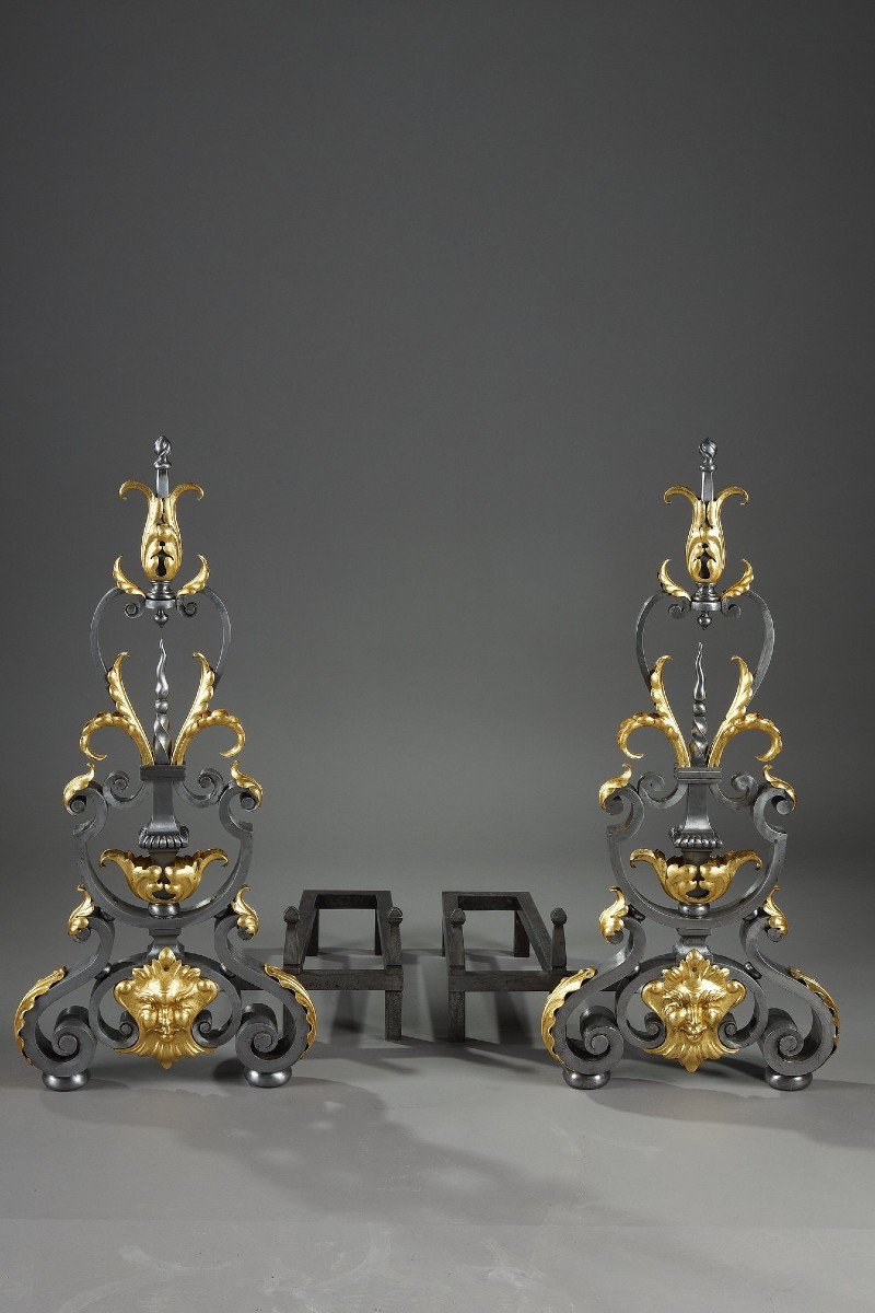 Pair Of Wrought Iron Landiers (andirons) With Foliage Decor, Mask And Volutes