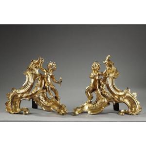 Pair Of Andirons With Cupids In Gilt Bronze, Louis XV Period.