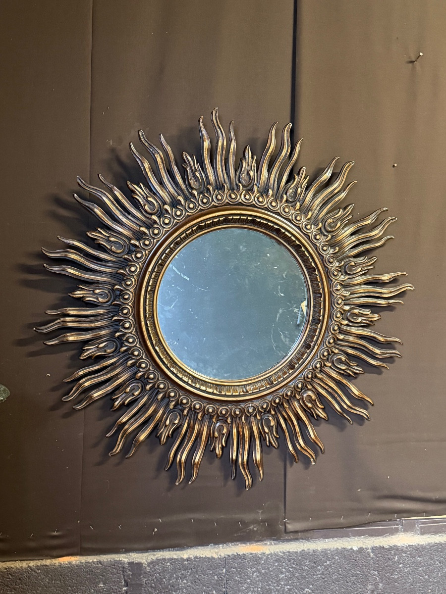 Important miroir soleil en bois sculpté 120cm