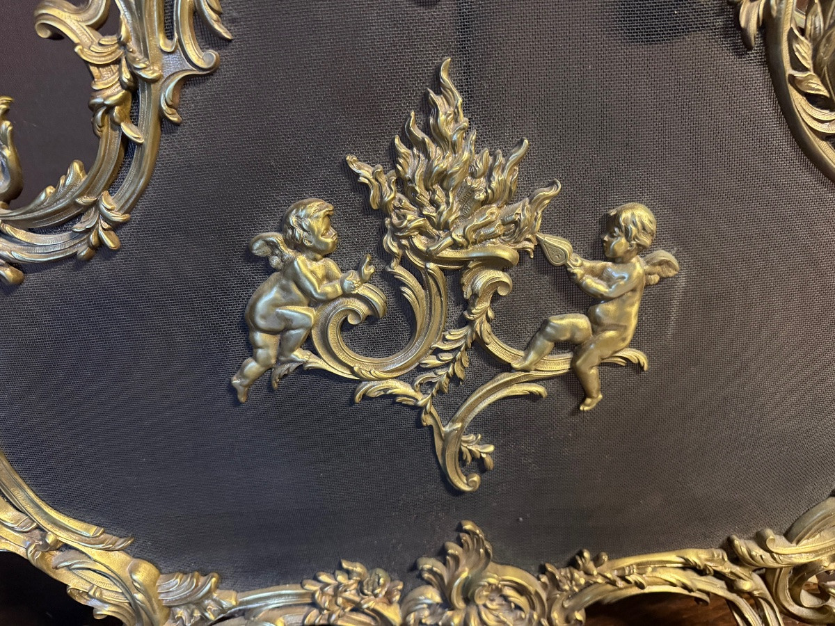 Pare étincelle en bronze doré à décor de chérubins -photo-2